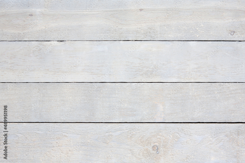 Naklejka premium Close up of old weathered wood planks. Flat lay, horizontal, rustic, wooden boards. White, grey colour.
