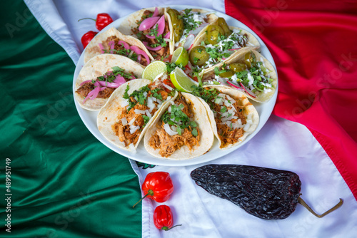 Fresh and tasty tacos with chili peppers , mexican street food 