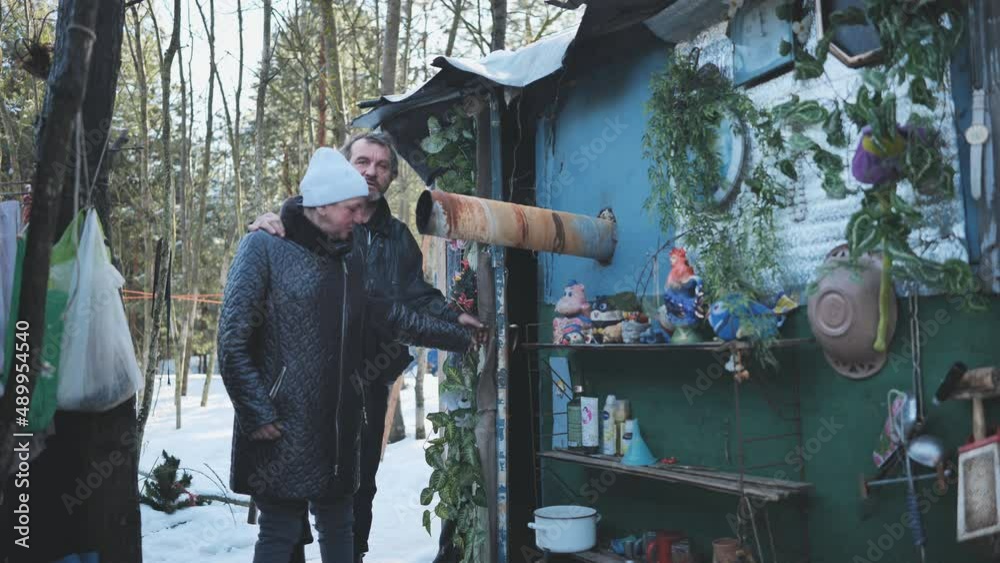 Homeless people go into their huts in the winter in the woods. Homeless people go into their huts in the winter in the woods.