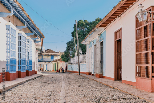 Old cobbled street in Trinidad, Cuba, with architectural heritage in colonial style.