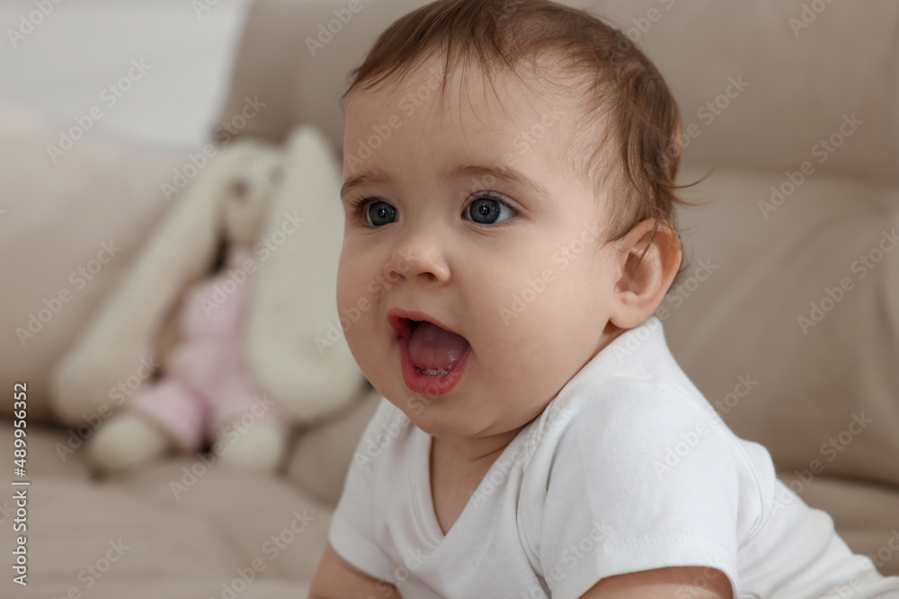 Cute little baby on sofa at home Cute little baby on sofa at home