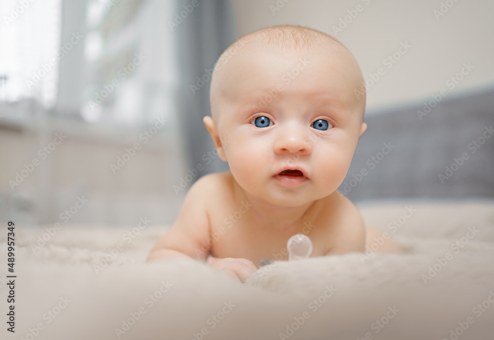 Funny and beautiful baby on the bed. children's health. Funny and beautiful baby on the bed. children's health.