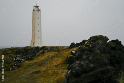 Malarrif lighthouse on the cliff near the ocean in Western Iceland. Snaefellsnes (Snæfellsnes) peninsula photo