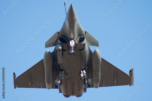 Avión de combate Rafale aterrizando visto desde abajo photo