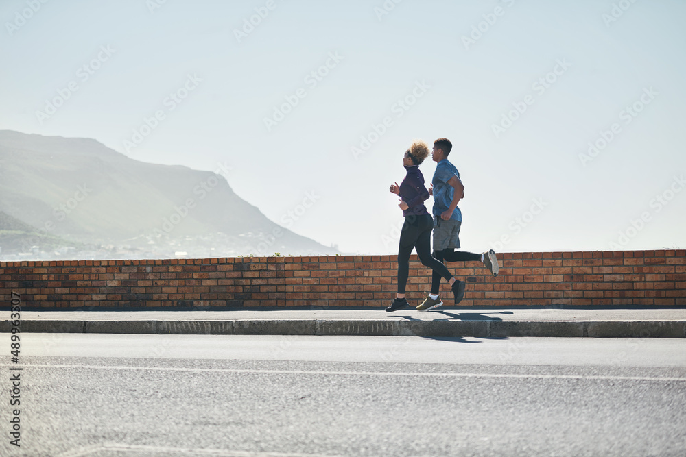Theres no stopping them. Shot of a young couple out for a run together. Theres no stopping them. Shot of a young couple out for a run together.