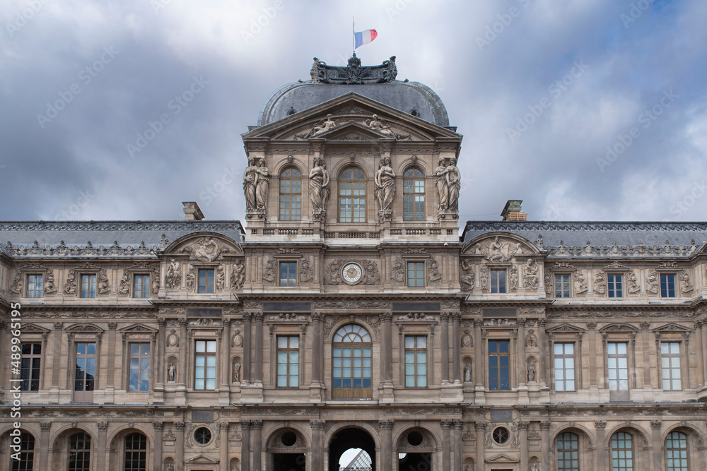 Detail of the exterior architecture of the Louvre in Paris with its sculptures and statues