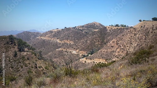 Wide view of Santa Monica Mountains with Mulholland Drive snaking across the landscape, seen from part of the Backbone Trail in national recreation area