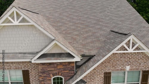 Residential Home Reveal Roof Rise Up. aerial view moves up residential home to reveal the roof and shingles