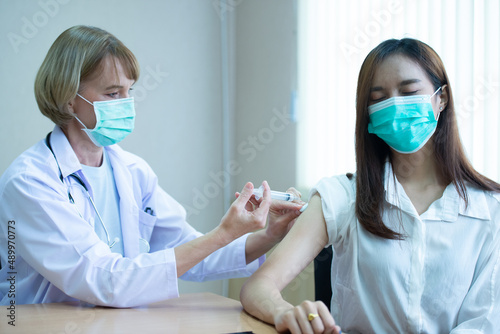 Doctor vaccinating patient To prevent disease in the hospital