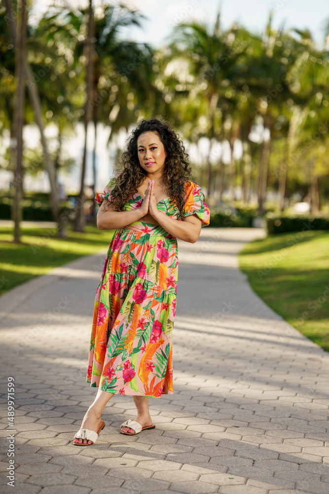 Model posing with praying hands