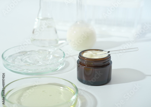 laboratory dishes and glassware on a lab table. fermentation, fermented beauty skin care. enzyme serum for anti age treatment.