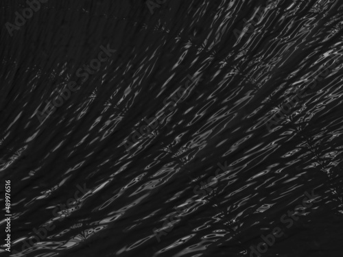Abstract black rippling background