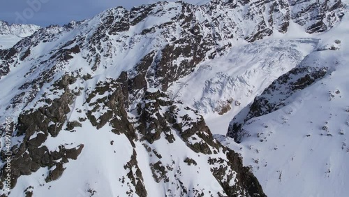 Winter drone flight over Mestia`s mountains in gerorgia. 
Tetnuldi Ski Resort next to Uschba and Tetnuldi Peak photo