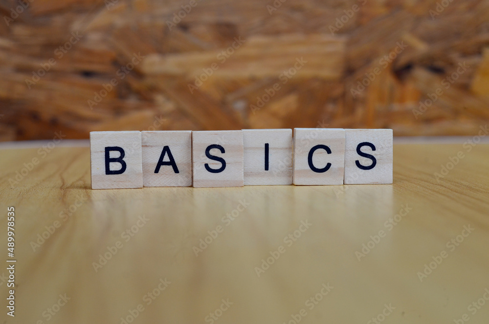 basics text on wooden square, business and motivation quotes basics text on wooden square, business and motivation quotes