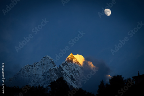 moon over the mountains during Everest Base Camp Trek over Mount Thamserku Namche Bazar photo