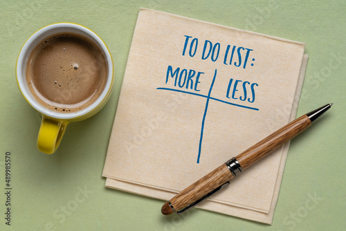 to do list - more or less, handwriting on a napkin with a cup of coffee, planning and goal setting concept