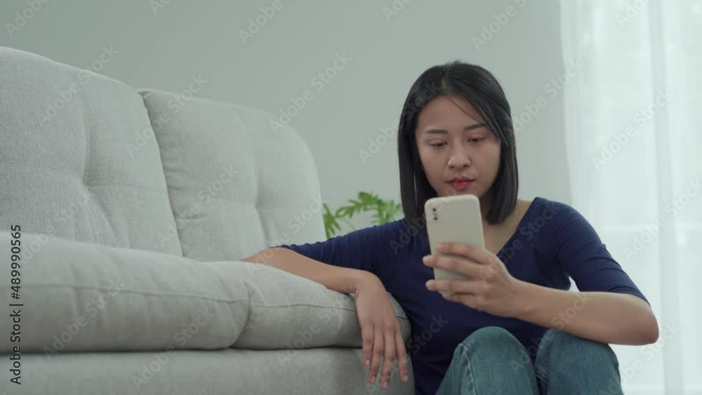 Beautiful Asian woman disappointed and sad after receiving bad news ...