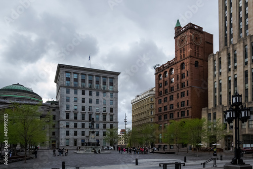 Montreal – May, 2017 – Architectural detail of the Place d'Armes, a square in Old Montreal quarter of the city. In the centre, the monument of Paul de Chomedey de Maisonneuve, founder of Montreal