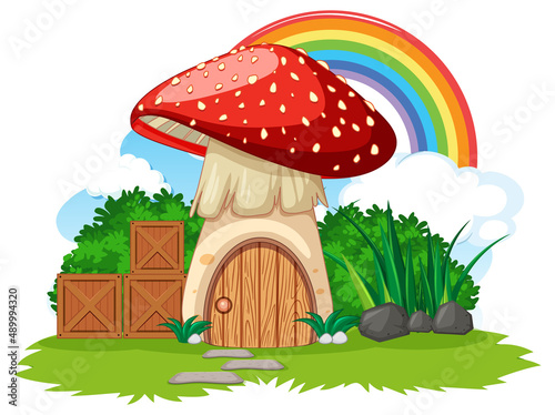 Fantasy mushroom house with rainbow in the sky