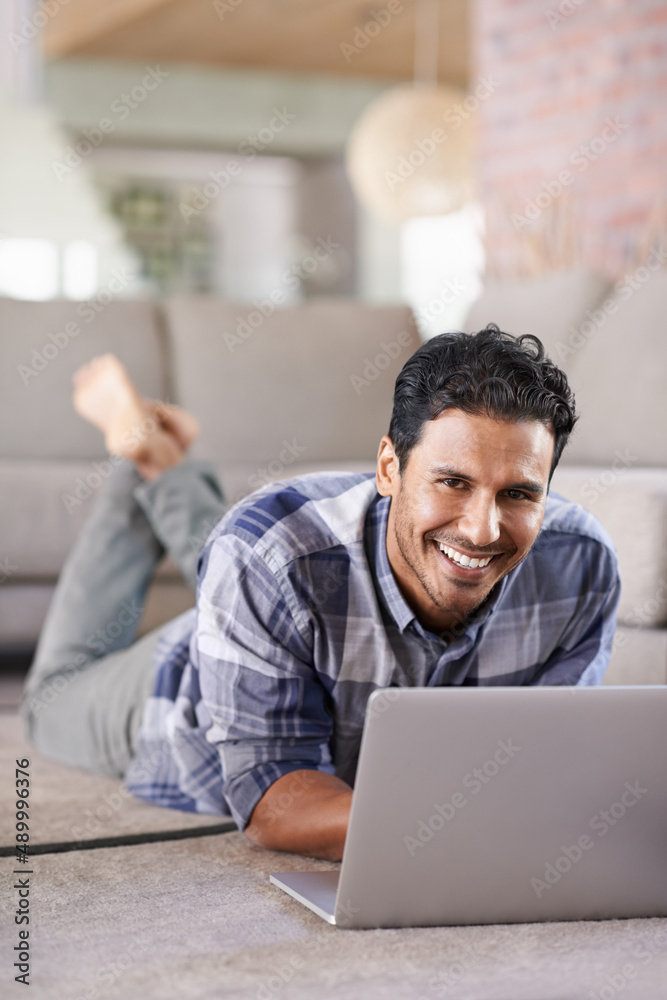 Where would we be without the internet. A young man using his laptop at home. Where would we be without the internet. A young man using his laptop at home.