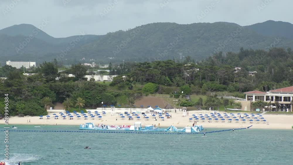 ONNA-SON, OKINAWA, JAPAN - AUGUST 2021 : View of Manza beach (Ocean or sea) in daytime. Summer holiday, vacation and resort concept video. ONNA-SON, OKINAWA, JAPAN - AUGUST 2021 : View of Manza beach (Ocean or sea) in daytime. Summer holiday, vacation and resort concept video.