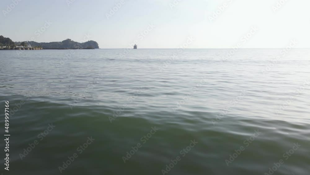 The long, sandy and tropical coastline of Damas Island at the west coast of Costa Rica. Revealing wide angle tracking shot The long, sandy and tropical coastline of Damas Island at the west coast of Costa Rica. Revealing wide angle tracking shot