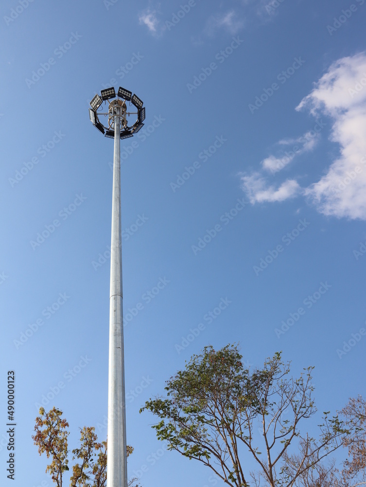 A large lamppost against a bright sky background. A large lamppost against a bright sky background.