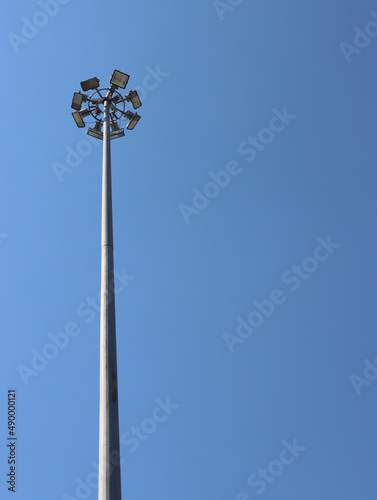 A large lamppost against a bright sky background.