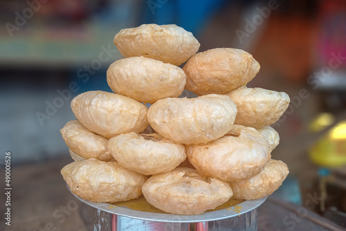 The image of an Indian deep-fried pastry is locally known as the Khaja. It's a popular sweet dish of Odisha, Andhra Pradesh, Bihar, Jharkhand, and Nepal. Selective focus photo