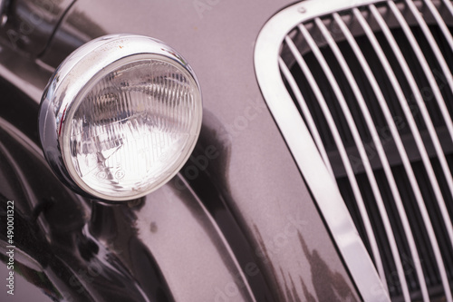 Detail of a circular vintage car light.