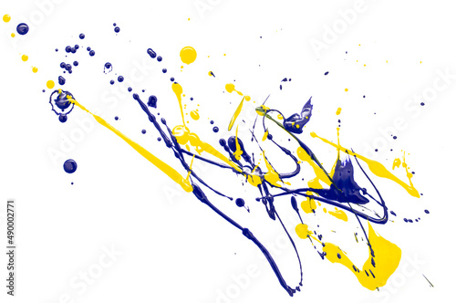 Fototapeta Naklejka Na Ścianę i Meble -  Drops of yellow and blue paint on a white paper background.