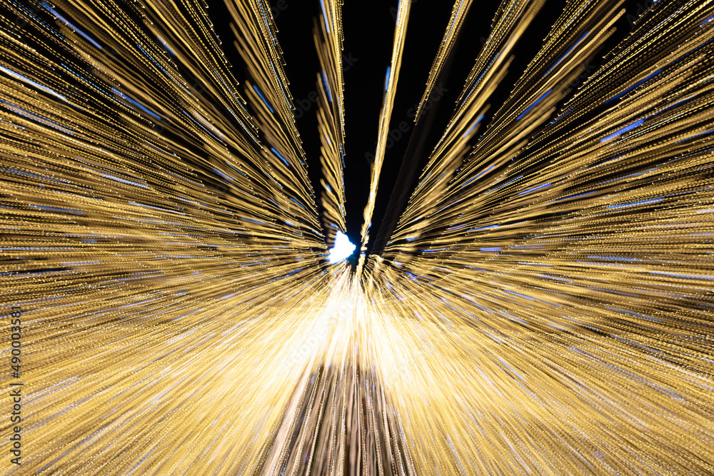 Obraz premium Festive lights in motion as an abstract background.