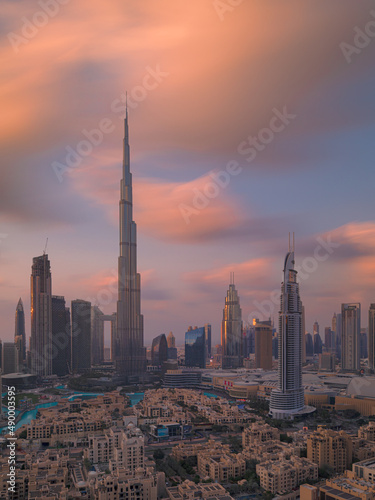 Dubai Downtown skyline during sunset on a cloudy day. Dubai, United Arab Emirates.
