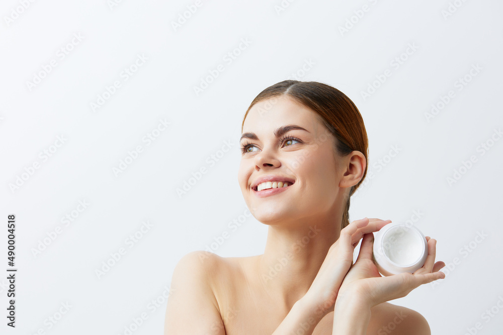 portrait woman smiling woman bare shoulders clean skin light background