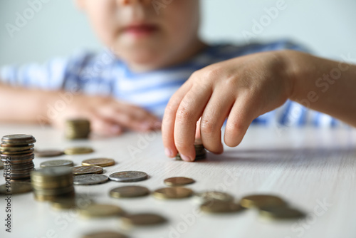 Child puts coin stack. Saving money, Concept finance business investment