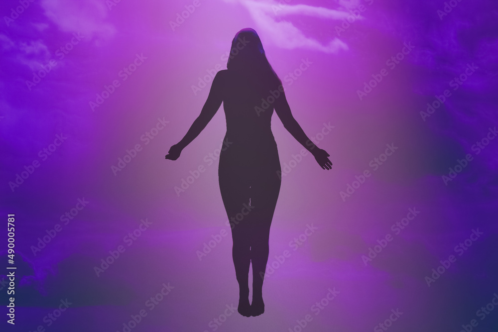 Fototapeta premium Soft focus. Ascension of the soul. The ghost of a woman ascends to heaven. Immortality, meditation, afterlife concept