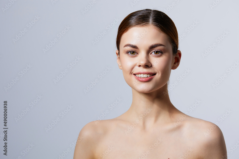 young woman smiling woman bare shoulders clean skin charm close-up Lifestyle