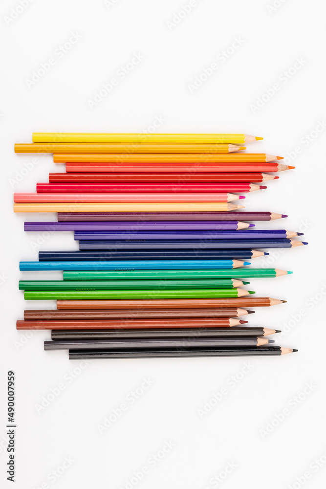 Many multicolored pencils, isolated on white background with copy space. Art and education background. Many multicolored pencils, isolated on white background with copy space. Art and education background.
