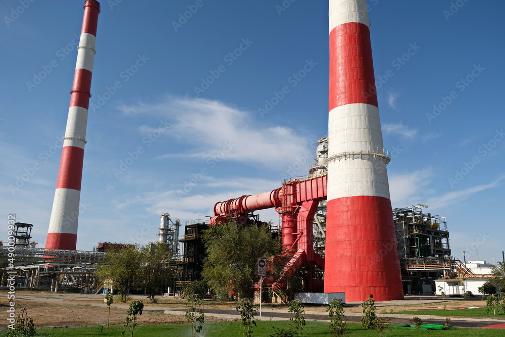 Shymkent / Kazakhstan - 09.26.2018 : Tanks, pipes and metal structures at the Petro Kazakhstan oil processing plant. Shymkent / Kazakhstan - 09.26.2018 : Tanks, pipes and metal structures at the Petro Kazakhstan oil processing plant.