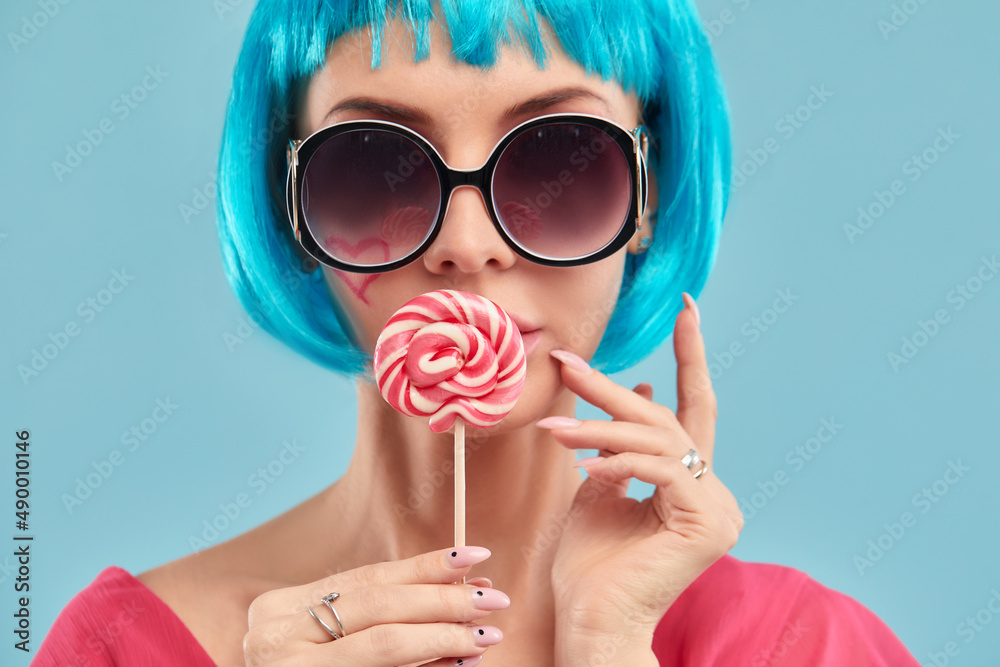 Candy Lolli pop Party Girl posing in blue studio. Role-playing games,  halloween concept, sweet lover Photos | Adobe Stock
