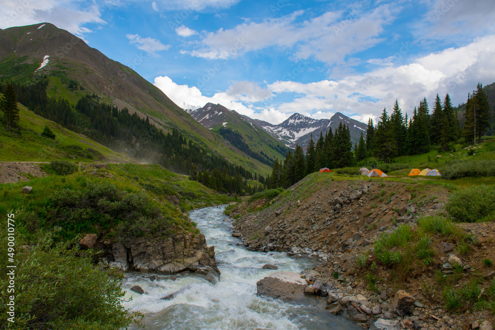 Camping by the river in the mountains