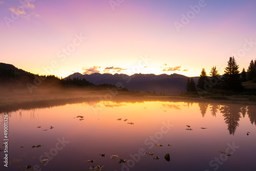 Reflected Sunrise Over Mountains