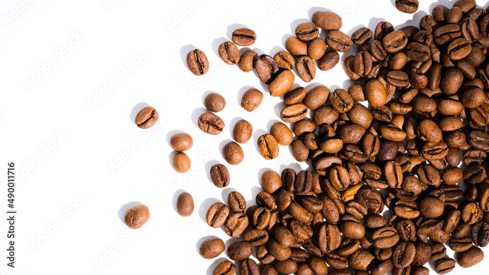 Obraz premium coffee beans isolated on white background,light roast coffee bean cover banner background.