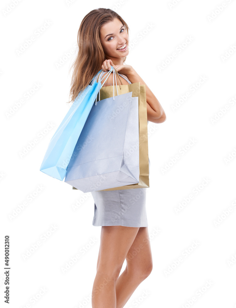 Theres no other way to get your therapy. Studio portrait of an attractive young woman carrying a bunch of shopping bags.