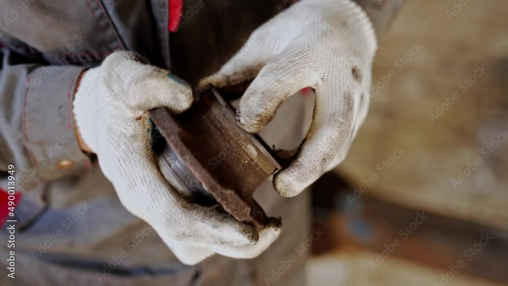 the master twists in his hands an old rusty automobile wheel bearing the master twists in his hands an old rusty automobile wheel bearing