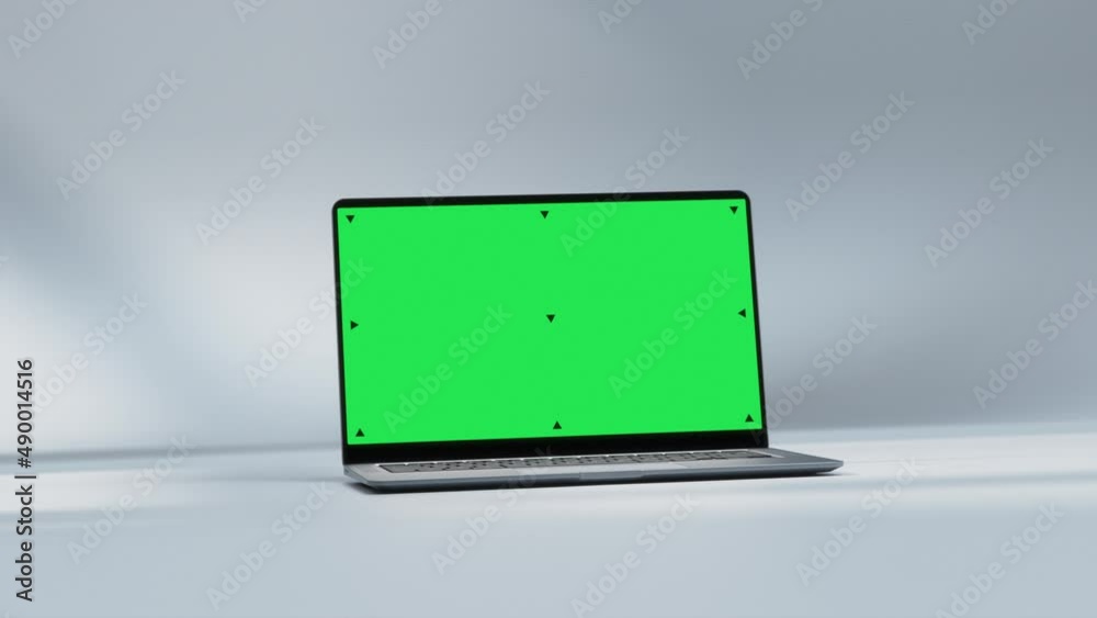 Mockup Shot of Laptop Computer with Green Screen in Bright, Cozy, Sunlit Abstract Environment. 3D Animation. Screen has Tracking Markers Mockup Shot of Laptop Computer with Green Screen in Bright, Cozy, Sunlit Abstract Environment. 3D Animation. Screen has Tracking Markers