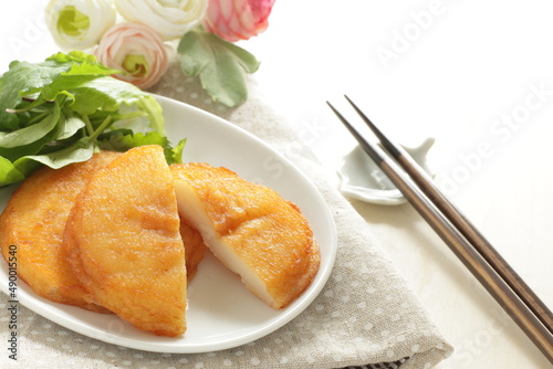 Asian food, deep fried sticky rice cake served with baby leaves with copy space