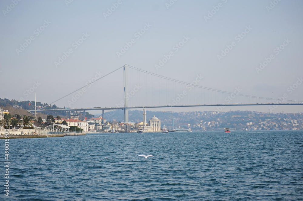 Istanbul / Turkey - 02.28.2017 : Coastal zone and architecture of the Bosphorus Strait. A bridge connecting Europe and Asia.