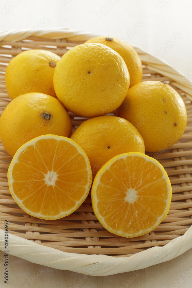 Japanese Shonan Golden mandarin orange on bamboo basket Japanese Shonan Golden mandarin orange on bamboo basket