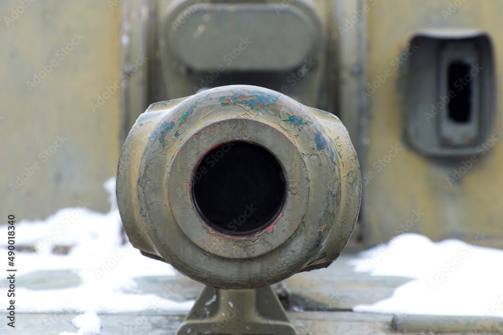 Gun barrel close-up, front view. Russian aggression against Ukraine. Violation of the sovereignty of a European country.